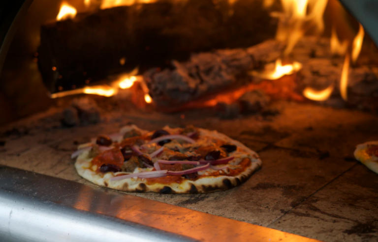 cooked pizza in hot pizza oven