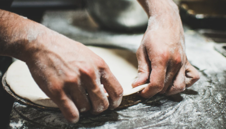 stretching pizza dough