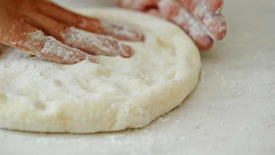 why is my pizza dough sticky